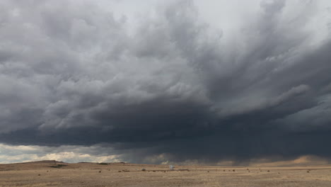 Two-bulls-fight-as-a-supercell-forms-in-the-foothills-of-the-New-Mexico-mountains