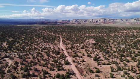 areal shot of following a road in cottonwood canyon, utah, usa