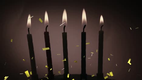 Animation-of-gold-confetti-falling-over-lit-birthday-cake-candles