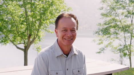 Senior-man-looking-to-camera-smiling,-outdoors