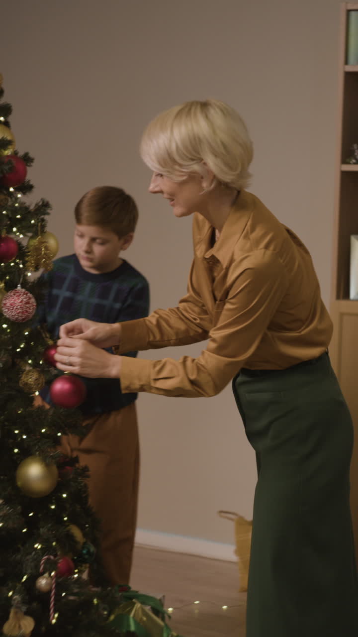 Family decorating a Christmas tree