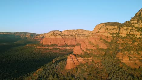 Great-downward-panning-shot-of-a-mountain-region-on-the-devils-bridge-trail-of-Sedona-Arizona