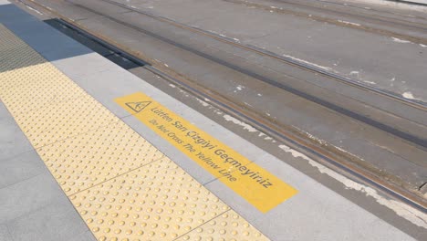 train station platform with warning sign