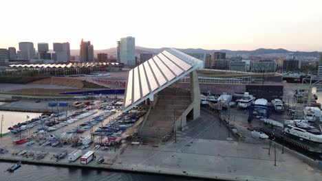 aerial shot of the port of barcelona at sunset