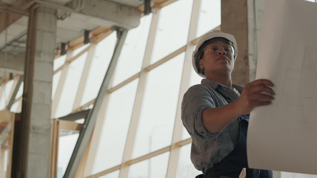 Professional Builder Looking at Paper