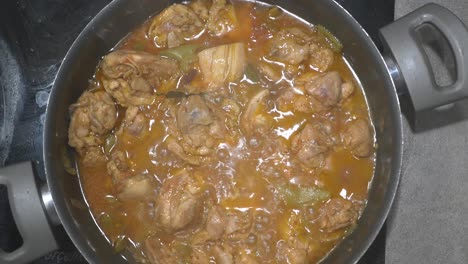 chicken stew cooking in a pan