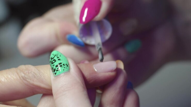 Evening out the surface of the nail with a nude base