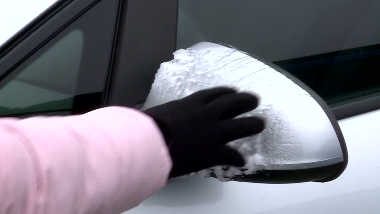 Removing Ice from a Car Mirror