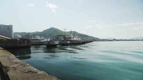 Establishing-view-of-Hakodate-harbor-lonely-on-a-sunny-day,-Japan