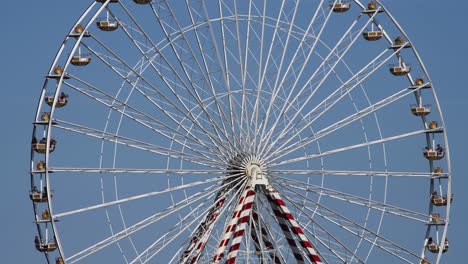 giant ferris wheel with clear blue sky, honfleur, normandy, france