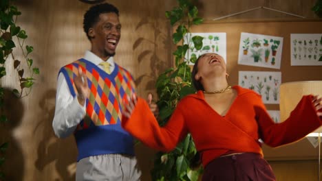 couple dancing in a stylish office setting