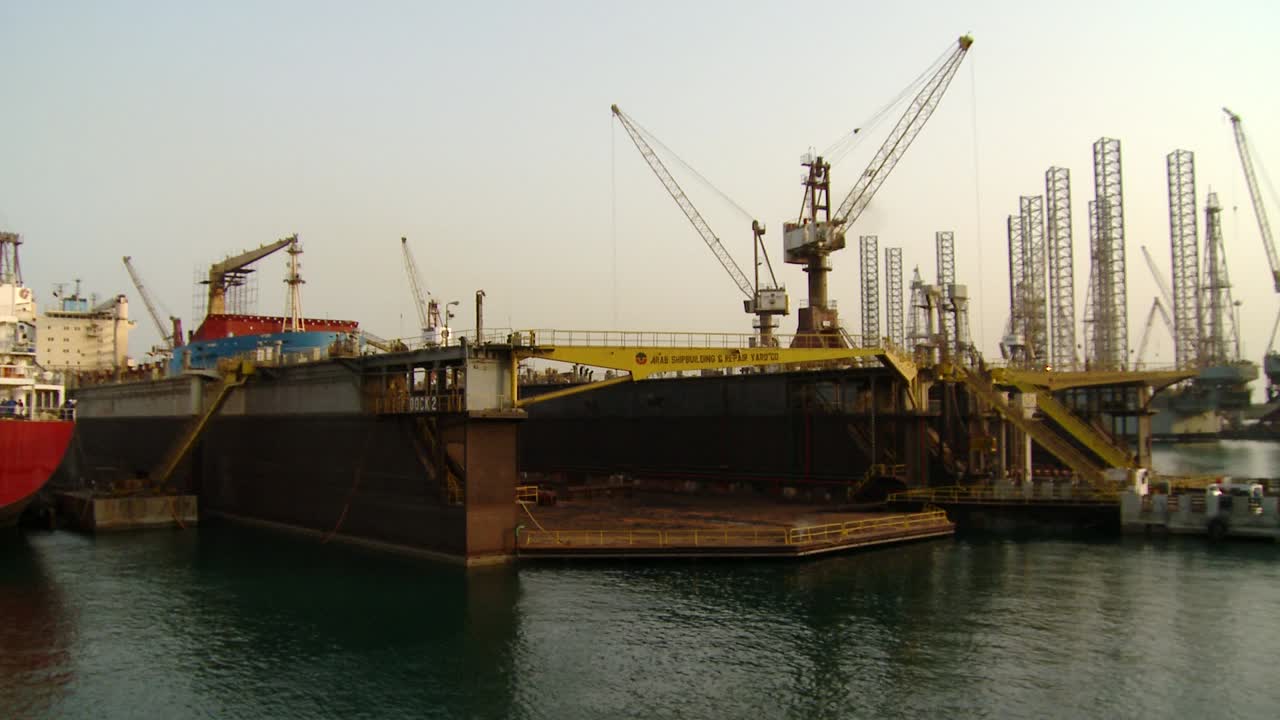 A one-minute day to night timelapse of an active dry dock in Bahrain