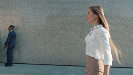 business woman walking in city