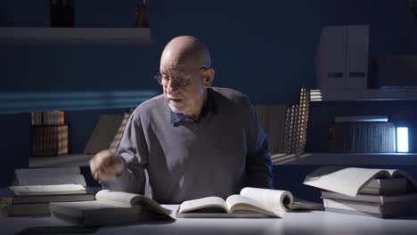 contemplative old researcher man getting stressed and confused in his office.