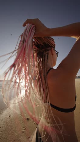 woman with braids on the beach