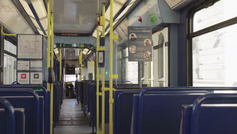 empty tram during the pandemic in oslo, norway driving straight