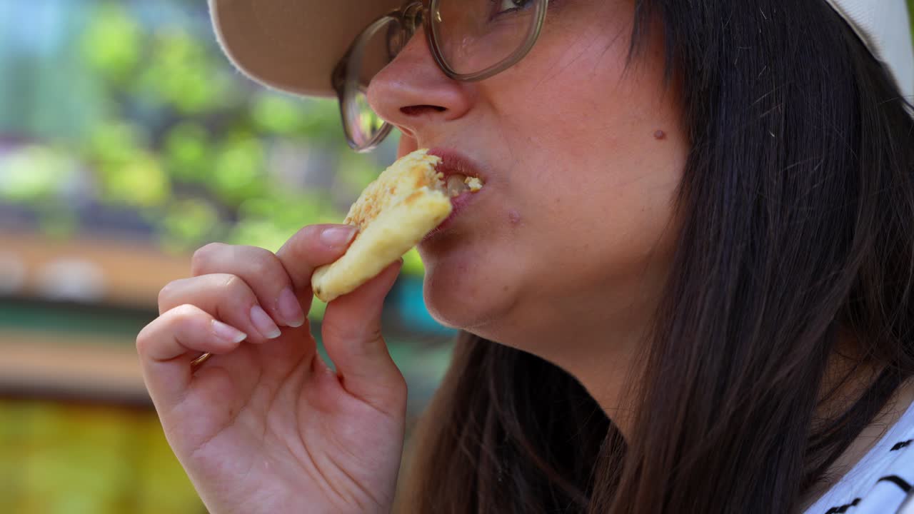 European tourist woman tasting a traditional Shaobing in the streets of Xian