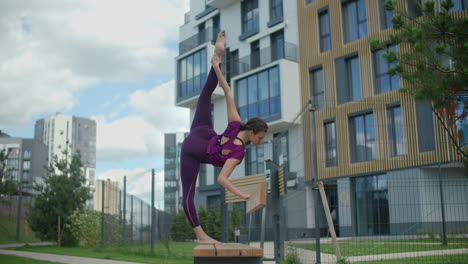 woman stretching in an urban park