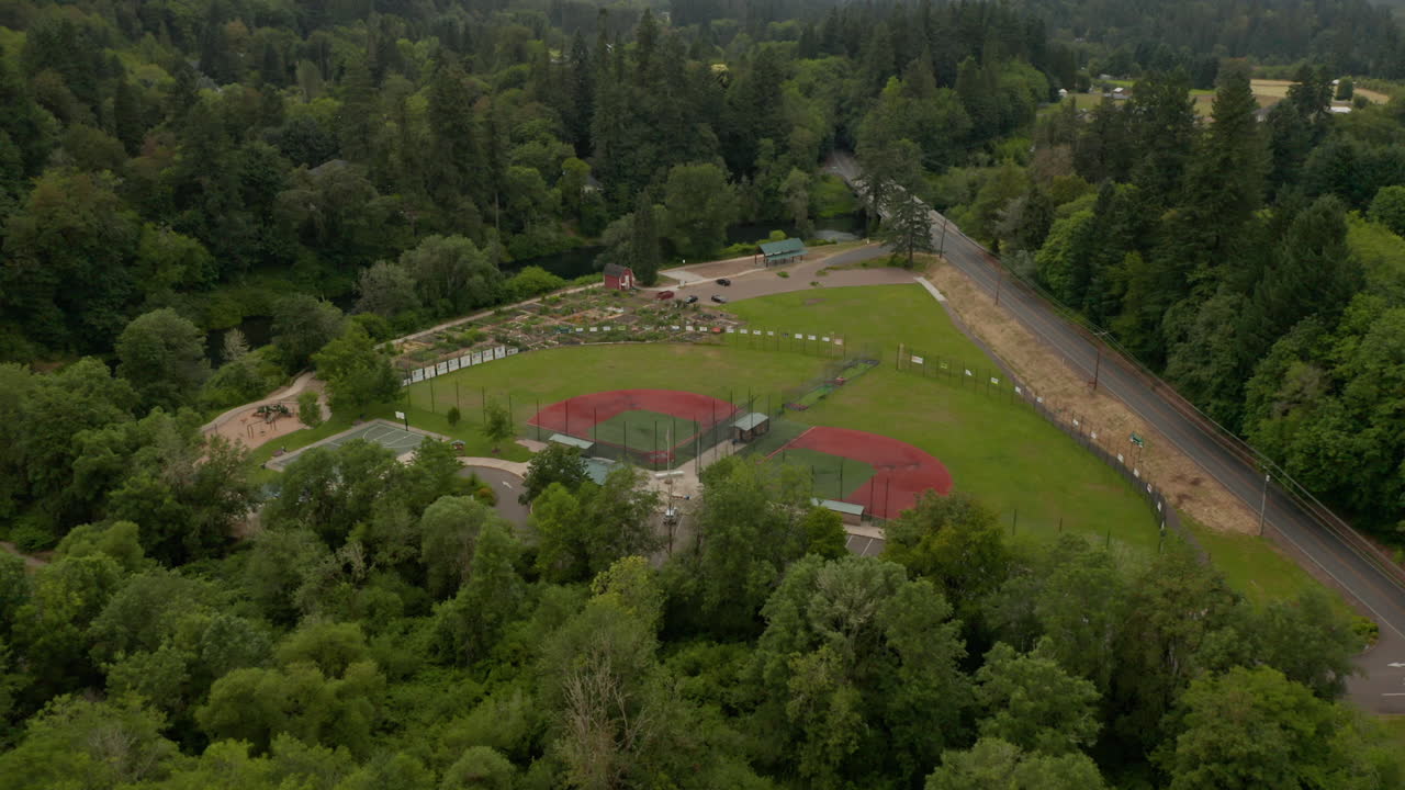 Aerial pan down over softball fields and tualatin river in west lynn oregon.