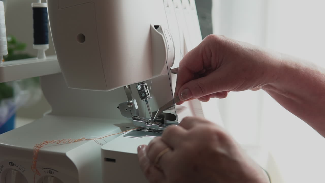 Forceps thread fabric adjustment on a sewing machine