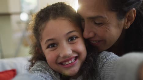 Portrait-of-happy-mixed-race-mother-and-daughter