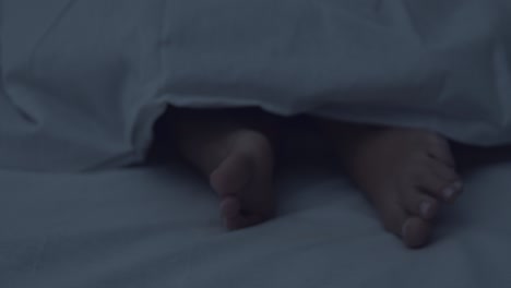 feet under blanket at night