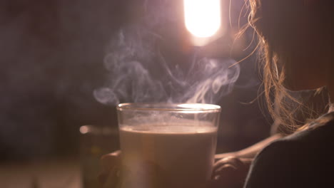 little girl child blowing scented candle out, smoke coming out. close up side