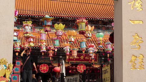 colorful lanterns moving in the temple courtyard