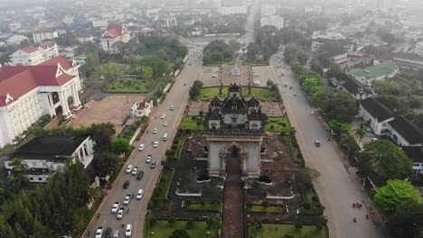 flying over famous victory gate at vientiane laos during sunrise, aerial