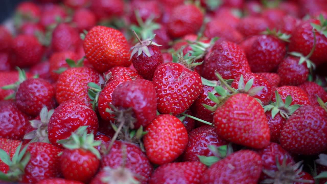 Close-up of ripe, red strawberries at a market