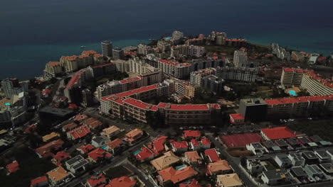 fly over funchal's hotel area with stunning aerial footage of the city's luxurious accommodations and beautiful sea views