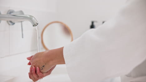 Water,-skincare-and-a-person-washing-hands