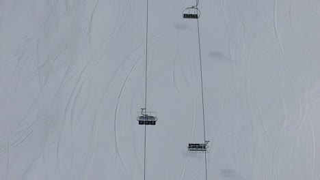 empty chairlift zenith view in alto campoo ski resort aerial shot
