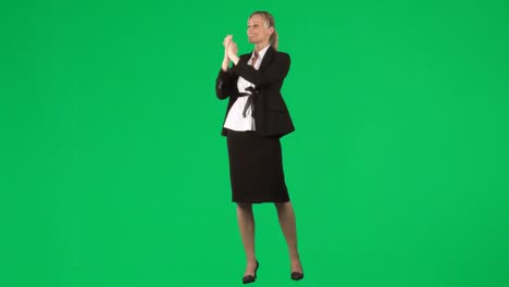 Isolated-businesswoman-clapping-against-green-screen