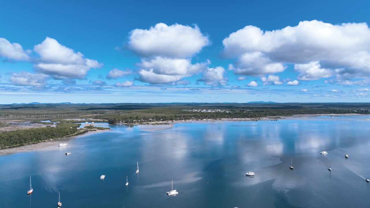 Flight over moored yachts to Tin Can Bay and Teewah Creek on a stunning fine day