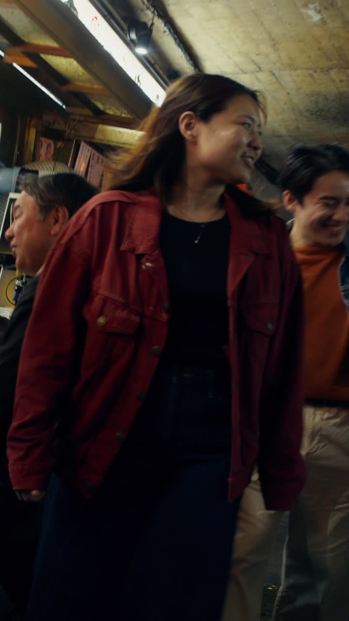 Group of friends walking through a city tunnel