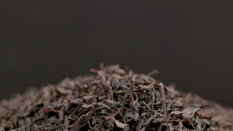 looped spinning dry black tea full frame close-up background