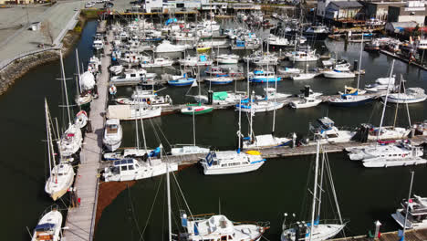 port alberni marina with fishing boats and yacht in daytime in vancouver island, bc, canada