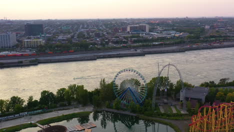 aerial view over the la ronde amusement park ferris wheel, dusk in montreal