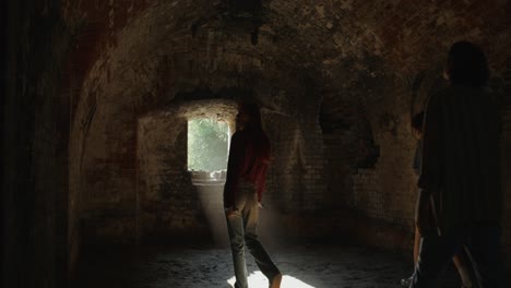 friends exploring a historic tunnel