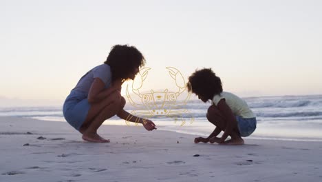 animación de cáncer sobre madre e hijo afroamericanos recogiendo conchas en la playa al atardecer