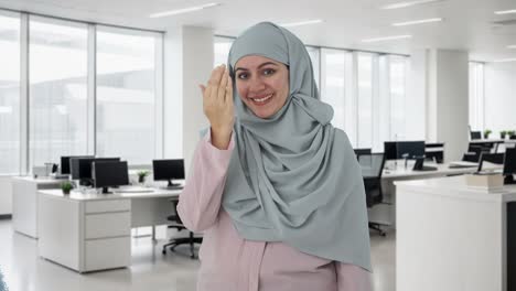 happy muslim businesswoman doing adaab