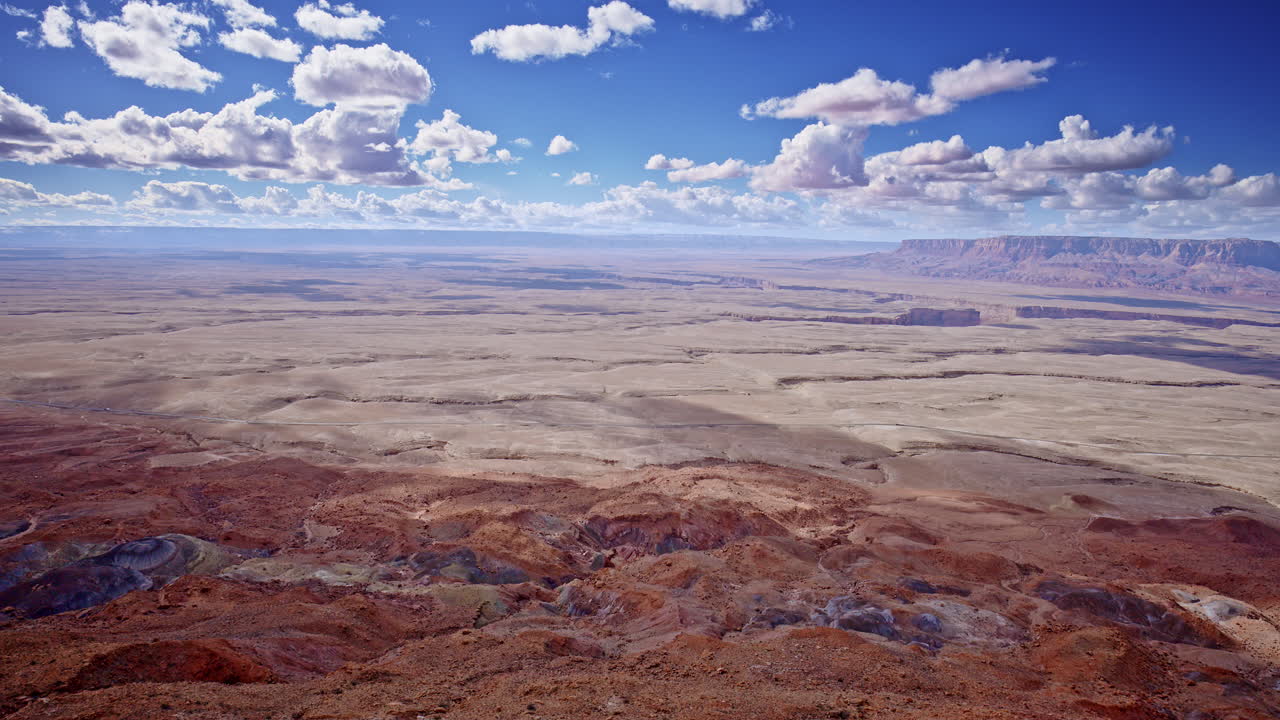 An aerial perspective captures the raw beauty of a jagged pass through Arizona’s red rock mountains.