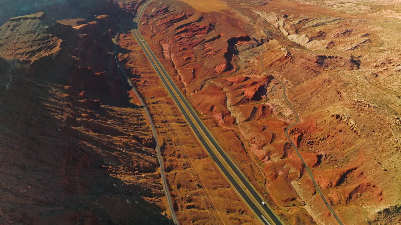 Roads in wonderful canyons of America. Cars driving fast along the motorways of Bryce National park. Top view.