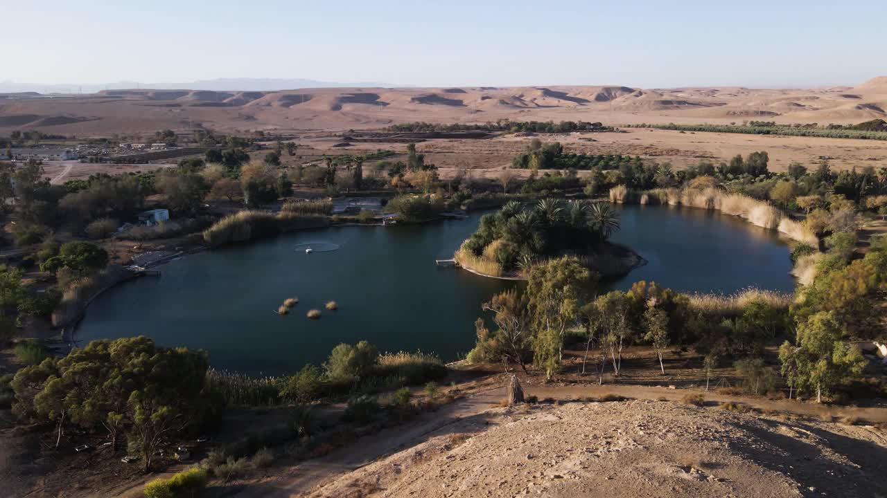 Ne'ot semadar oasis, surrounded by desert and greenery, aerial view