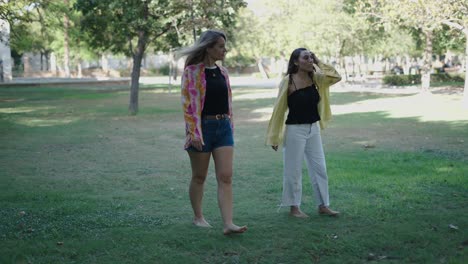 two friends walking in a park