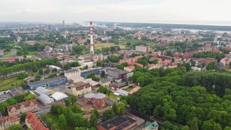 Industrial-town-in-Europe-with-residential-buildings,-aerial-view