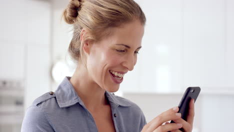 real woman using mobile phone at home drinking coffee enjoying relaxing  lifestyle