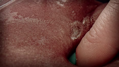 4k close-up of fingers digging in putty slime toy