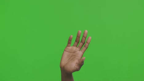 mano levantada en la pantalla verde